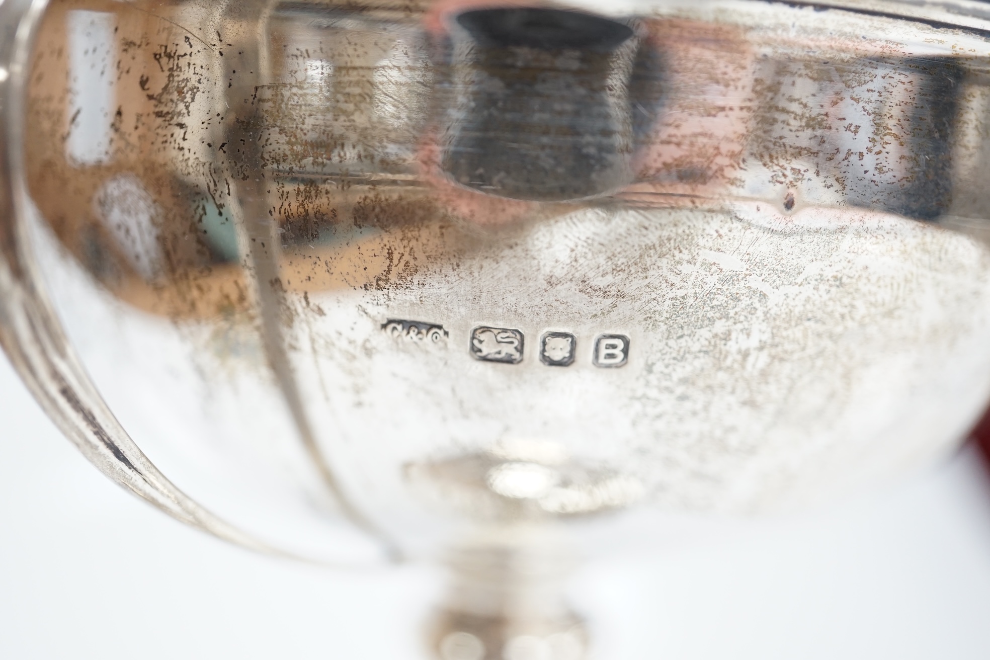 A 1930's silver two handled presentation greyhound trophy cup, with greyhound head handle terminals and engraved inscription, Carrington & Co, London, 1937, 18.7cm, 7.5oz. Condition - poor